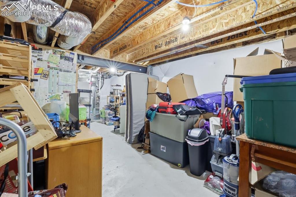 Image 45 of 50: The basement storage room has included wine storage and room for all your s