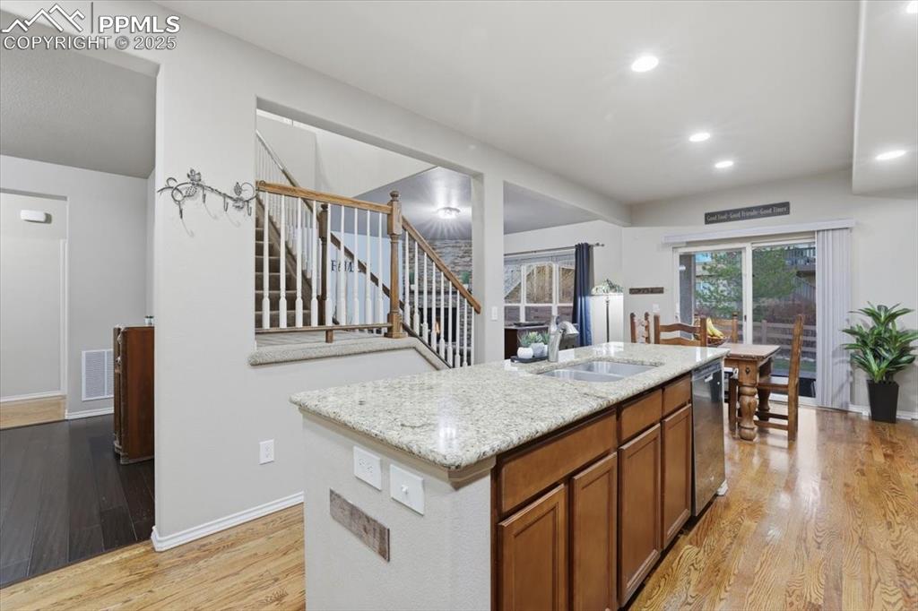 Image 9 of 50: The kitchen is open to the formal dining room, informal dining area and liv