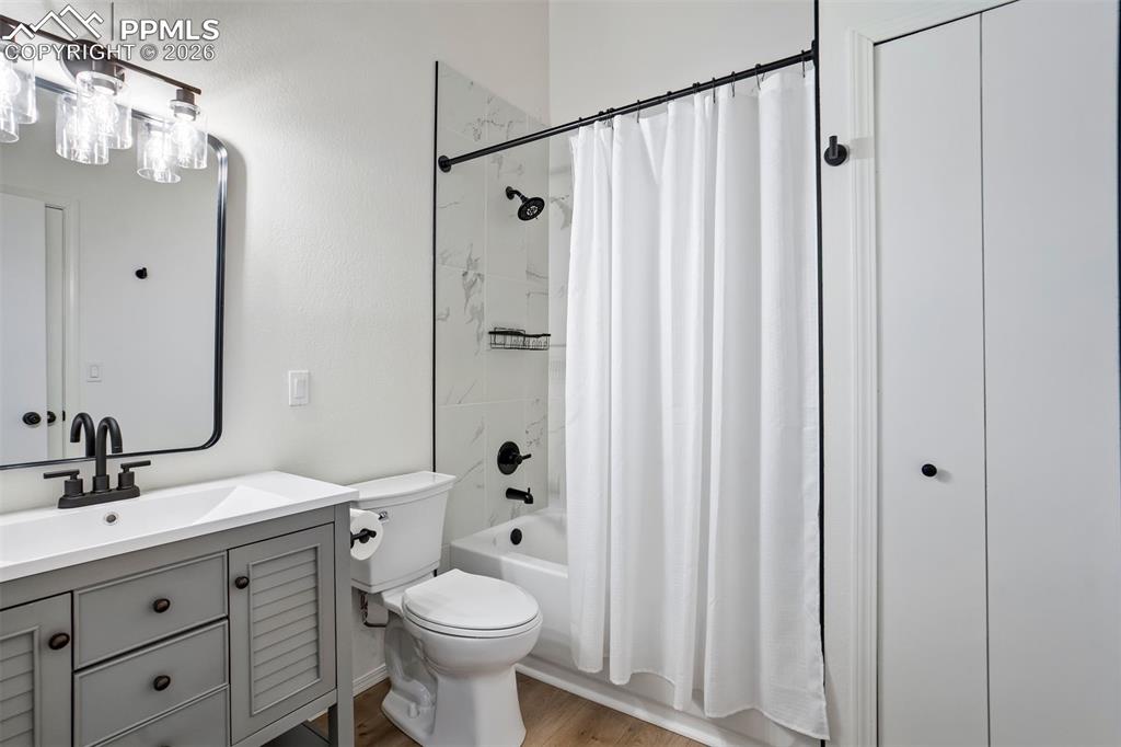 Image 21 of 39: Large full bathroom with closet. 