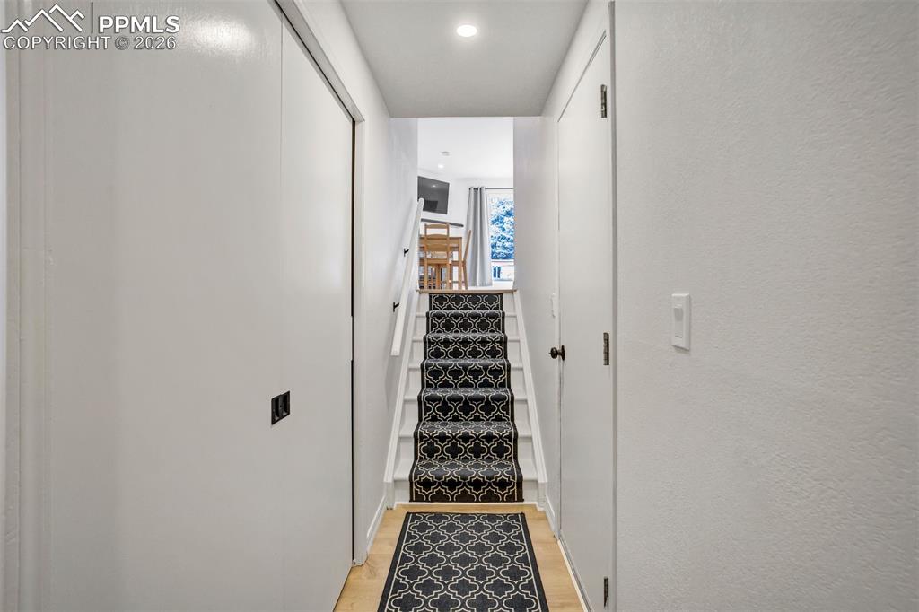 Image 30 of 39: Entry area by the front door & attached garage. 