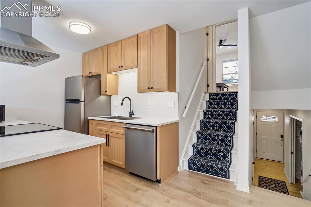 Image 4 of 39: Front door entry leads to the main level living area. 