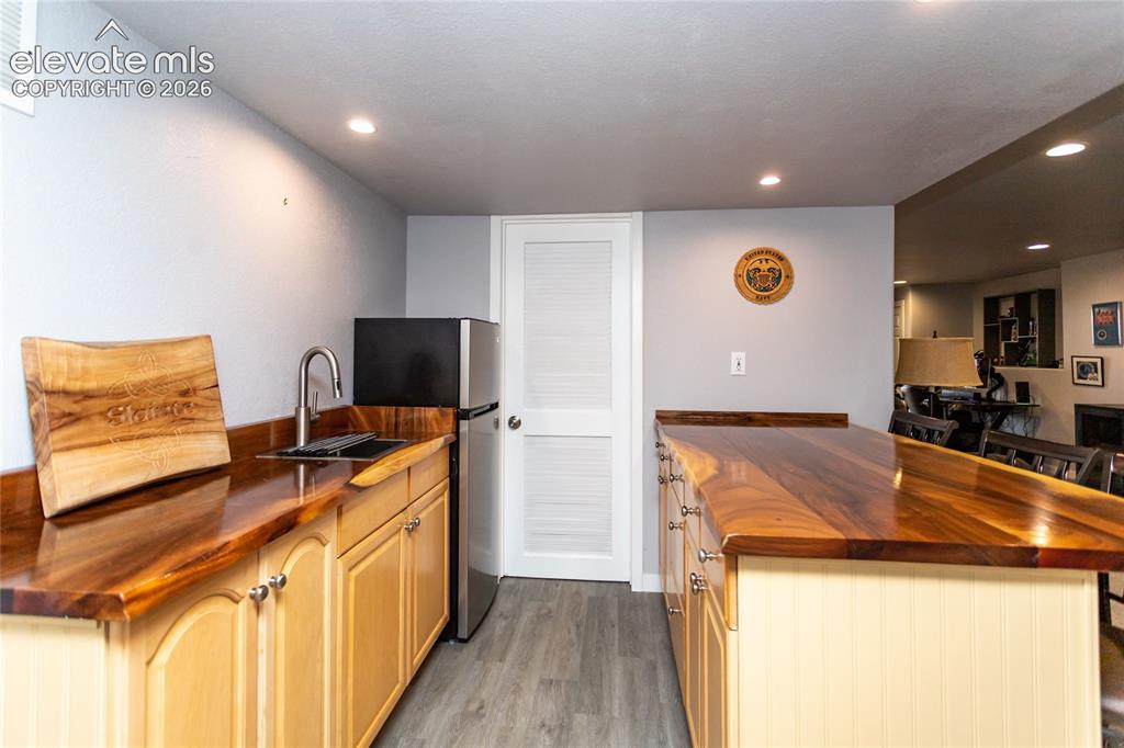 Image 31 of 44: Custom live-edge acacia wood bar top