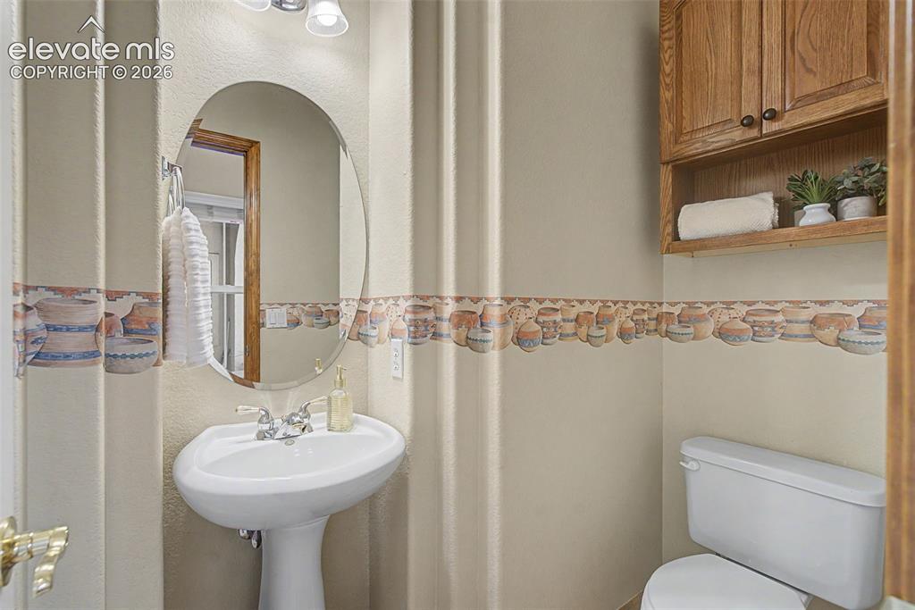 Image 30 of 50: 1/2 bath on main level