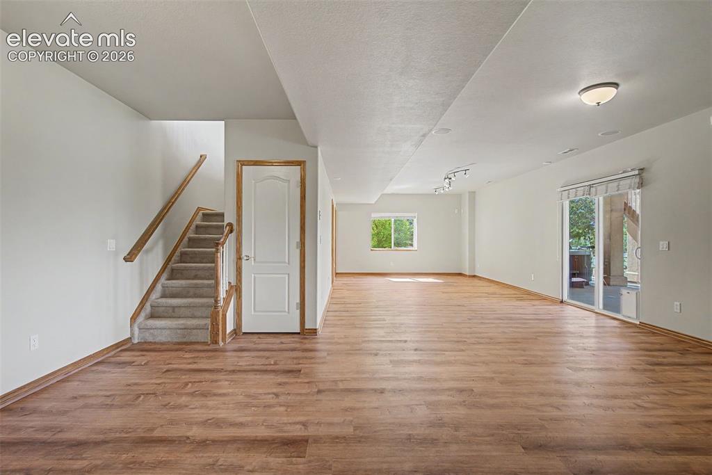 Image 35 of 50: Family room with walk-out to patio