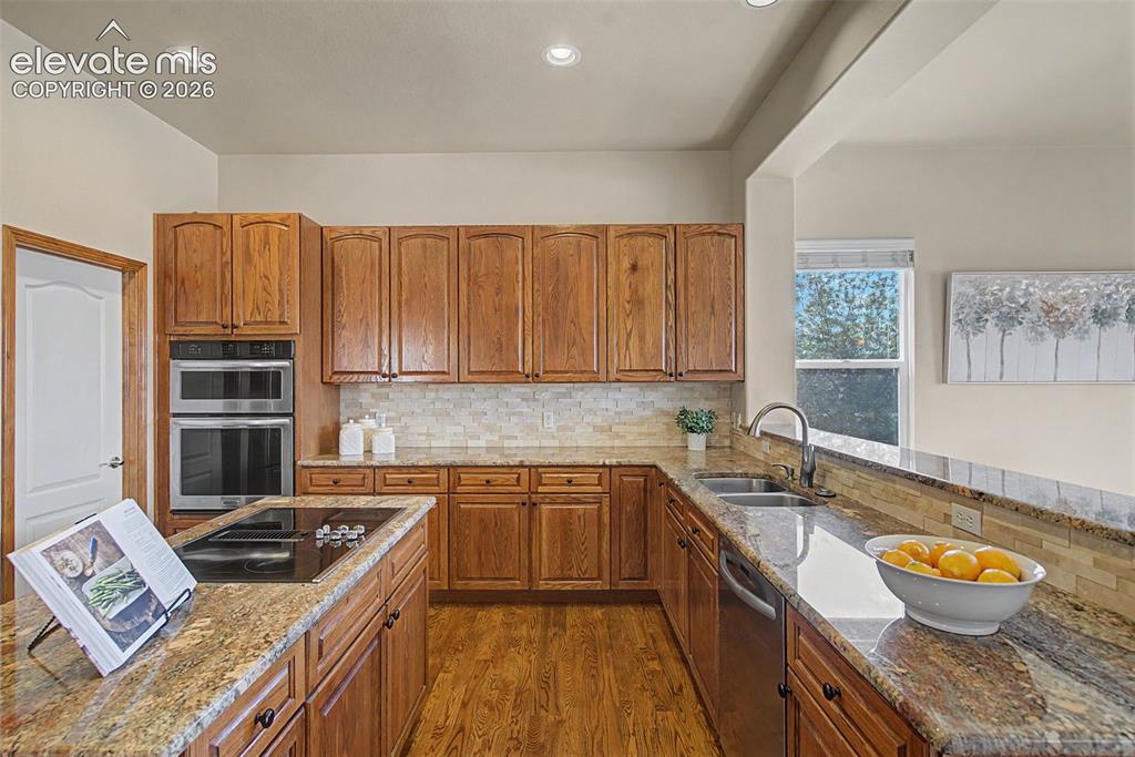 Image 8 of 50: Kitchen overlooking the dining room and the mountain views