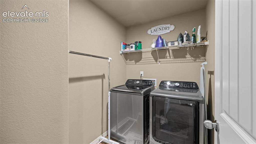 Image 23 of 41: Dedicated laundry area featuring a wire shelving unit, providing ample stor