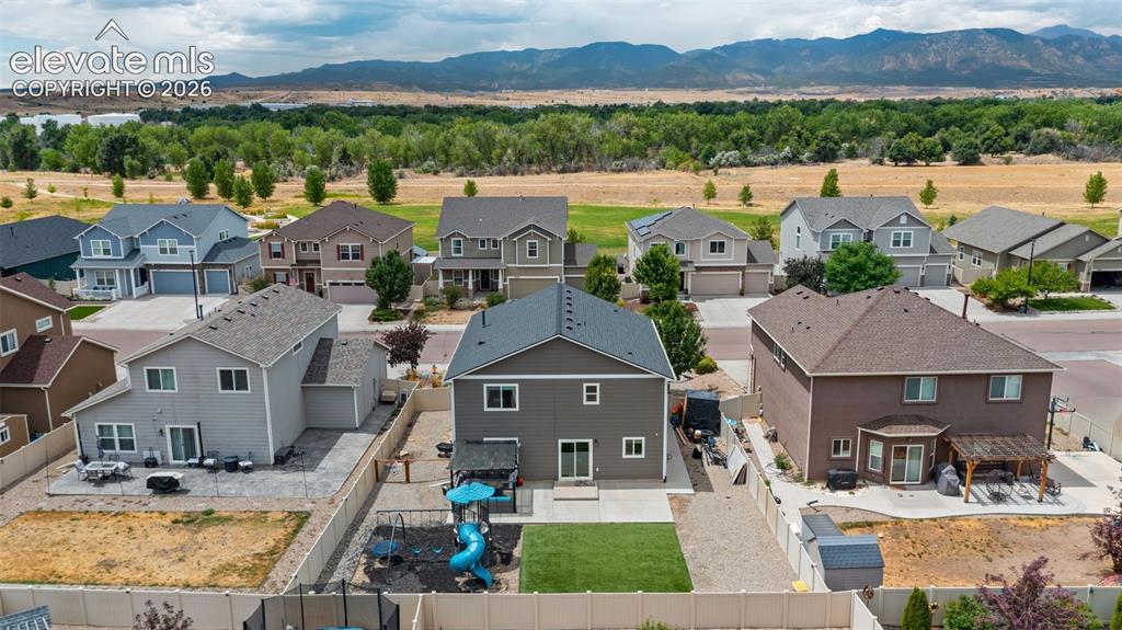 Image 35 of 41: Contemporary residential neighborhood with mountain backdrop