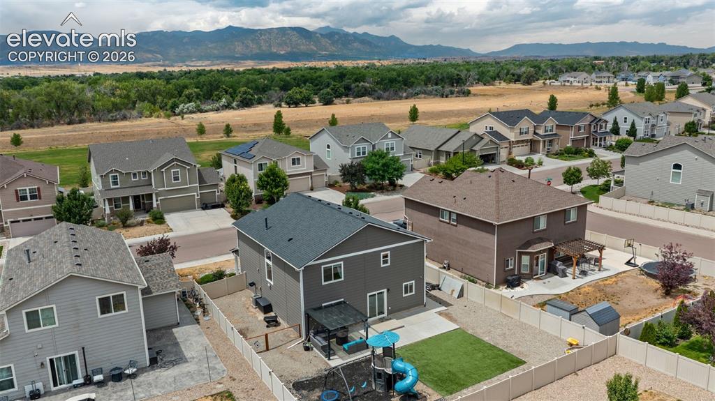 Image 37 of 41: Aerial perspective showcasing a residential development with distant mounta