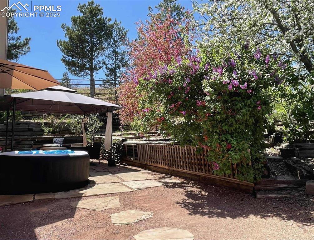 Image 29 of 45: View of patio.
Awning and hottub not included.