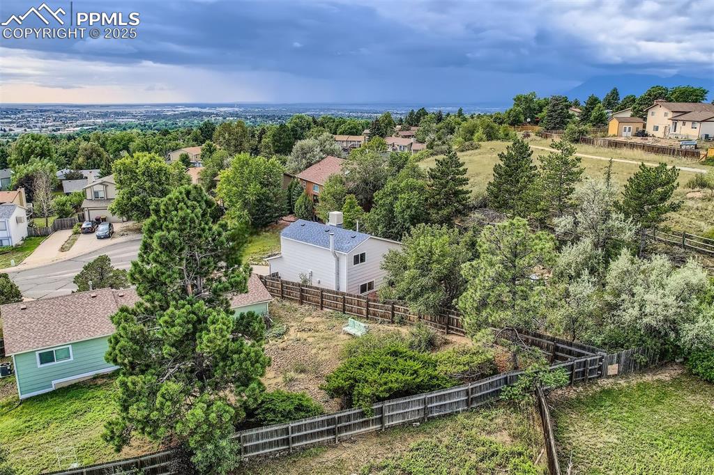 Image 42 of 45: Aerial perspective of suburban area with a tree filled landscape