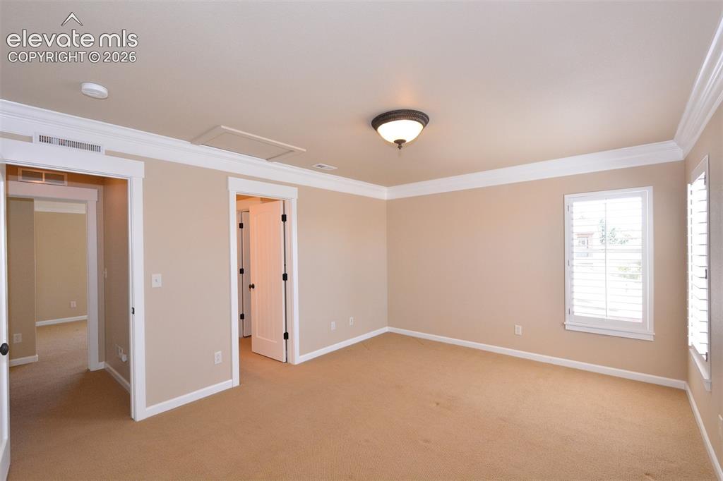 Image 19 of 31: Upper level bedroom