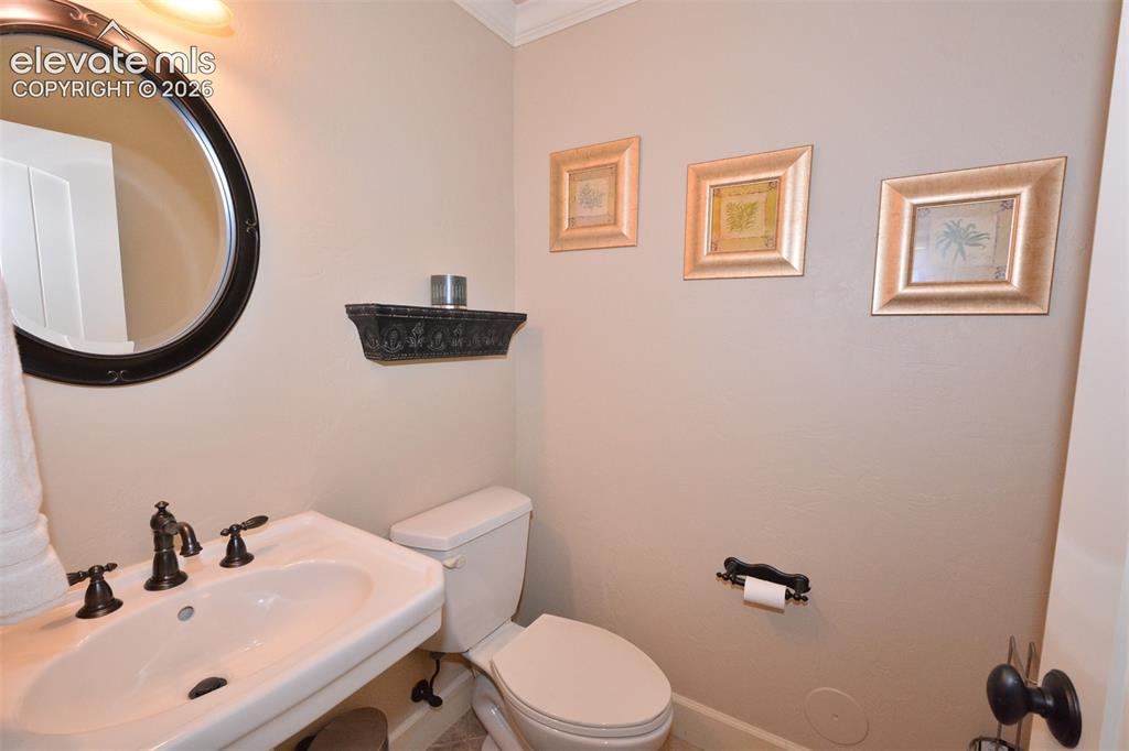 Image 24 of 31: Half bath in the basement
