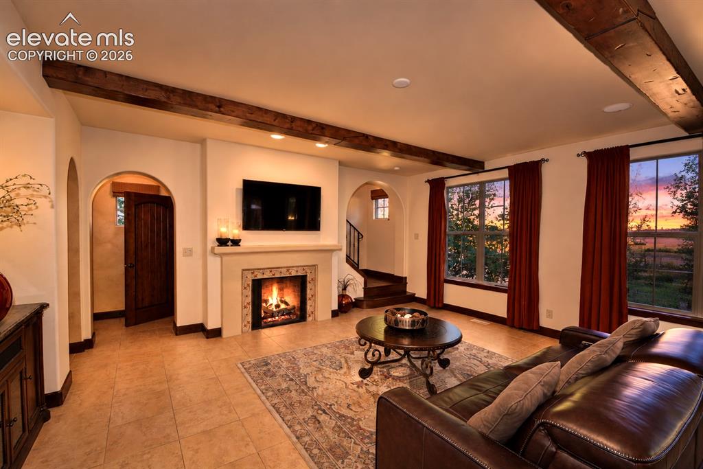 Image 9 of 31: Main level living room with fireplace