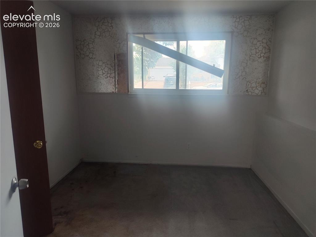 Image 10 of 18: Bedroom on lower level