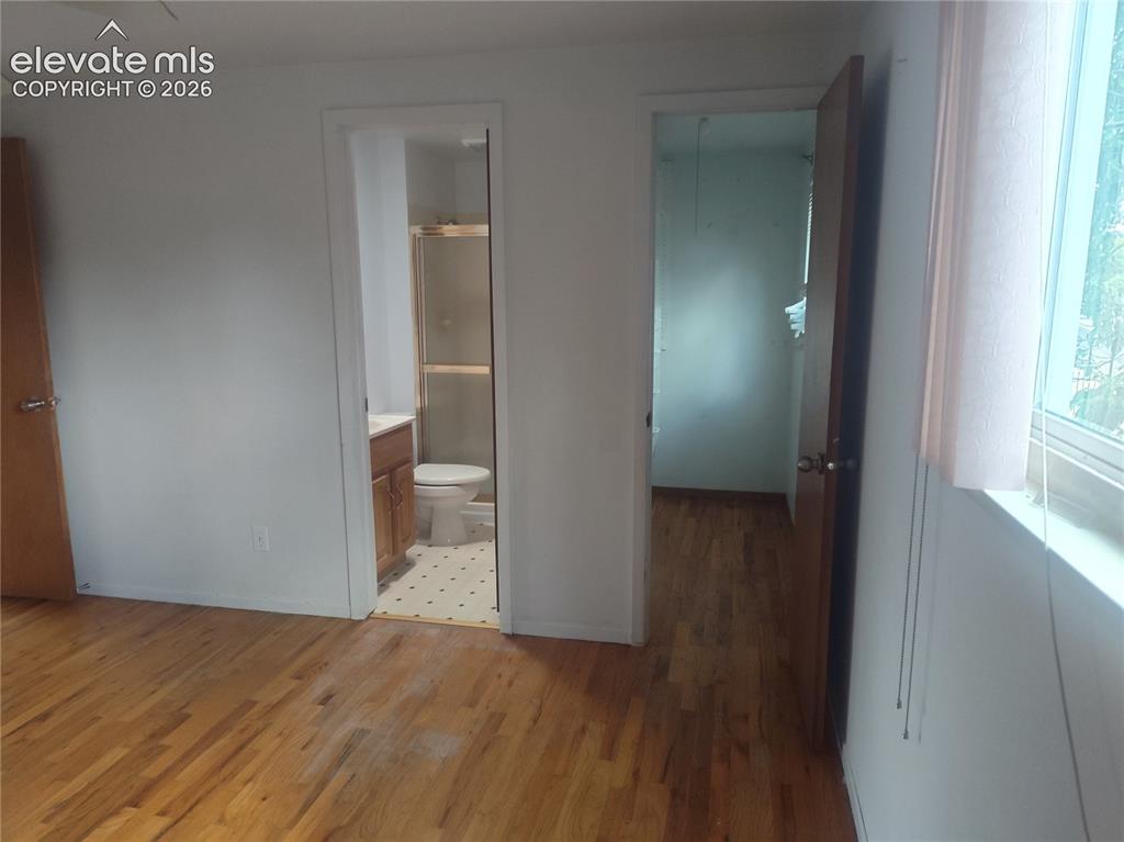 Image 12 of 18: Primary bedroom/bath