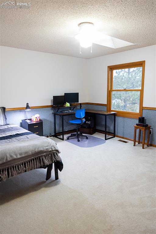 Image 33 of 47: Another bedroom on the upper level.