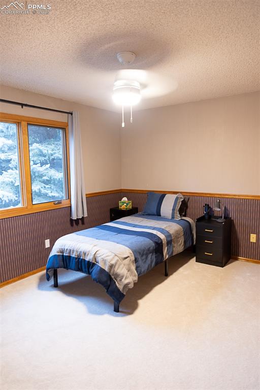 Image 37 of 47: Bedroom on upper level.