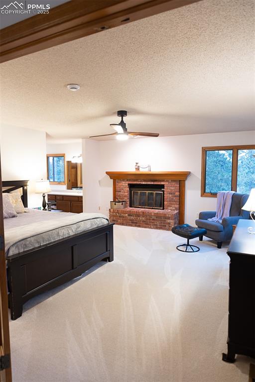 Image 38 of 47: Large primary bedroom with fireplace.