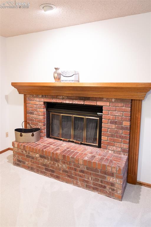 Image 40 of 47: Gas fireplace in primary bedroom.