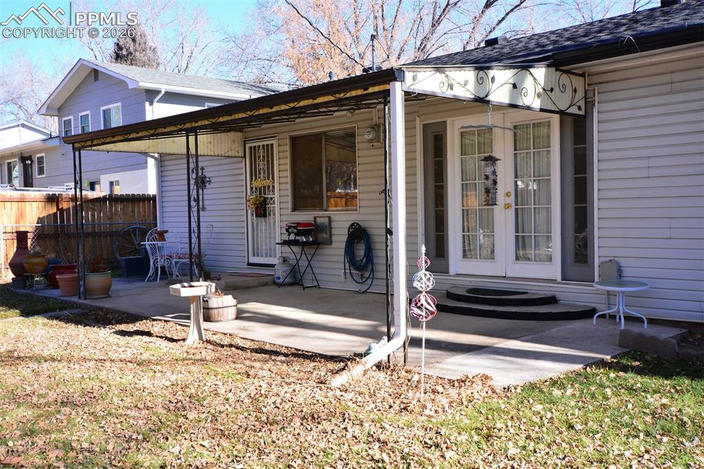 Image 21 of 24: rear covered concrete patio