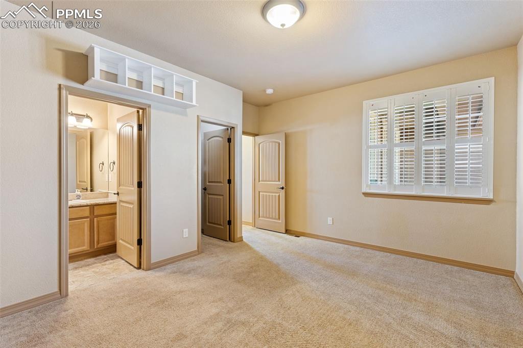 Image 21 of 50: Secondary Master bedroom