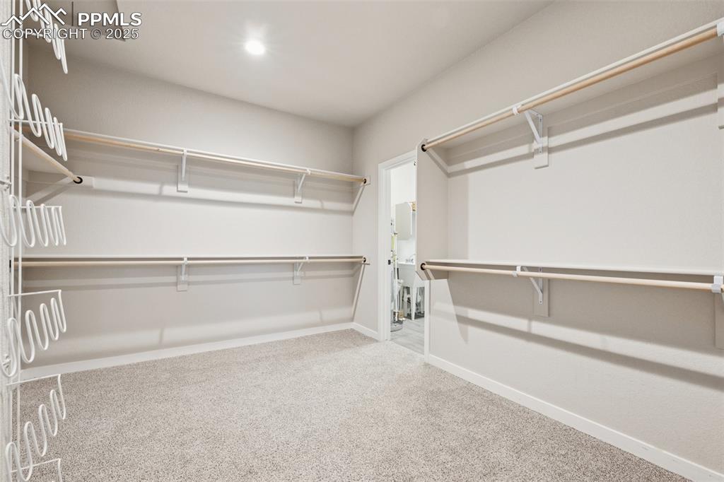 Image 18 of 35: Huge closet off primary bedroom