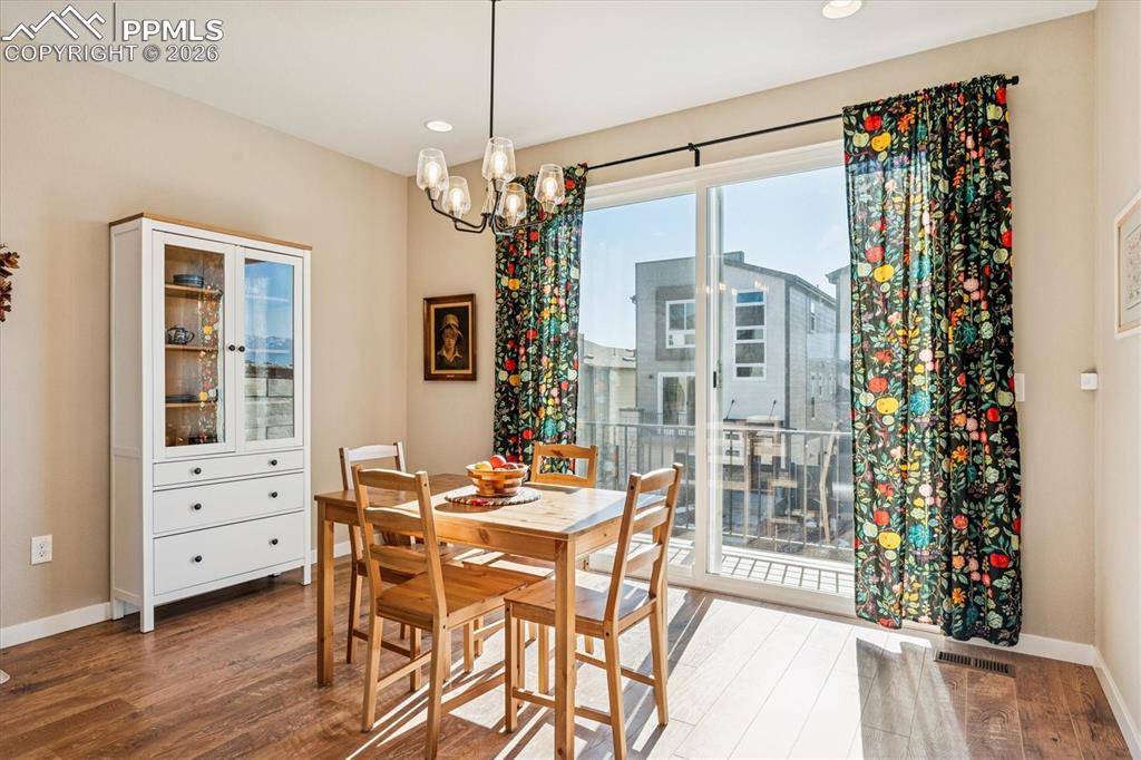 Image 10 of 22: Dining Room with Sliding Door to Balcony
