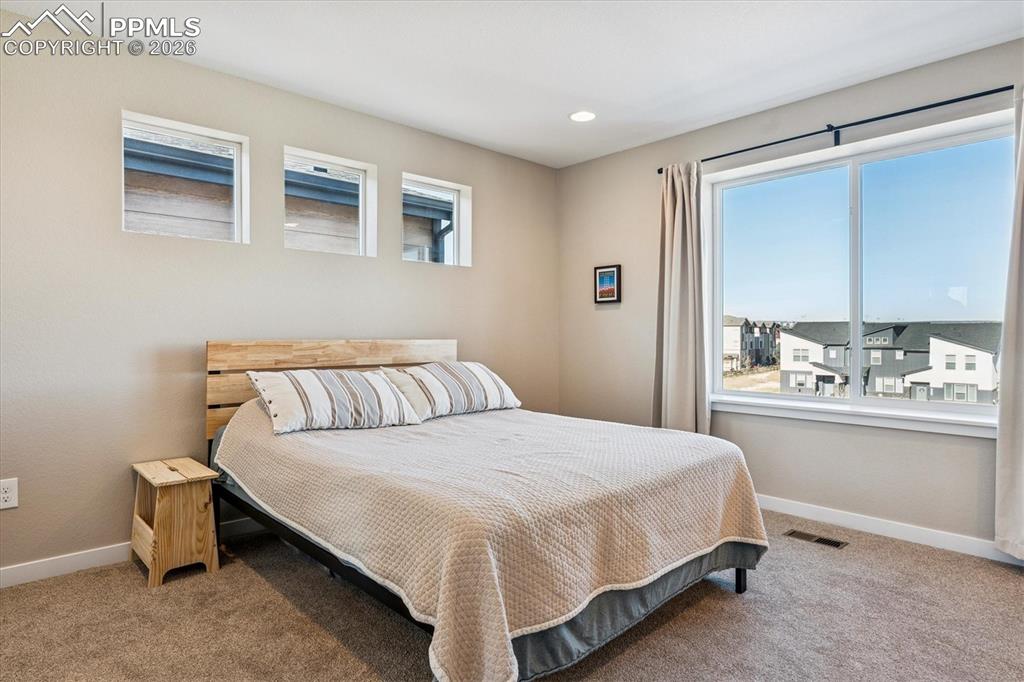 Image 12 of 22: Primary Bedroom with Large Picture Window