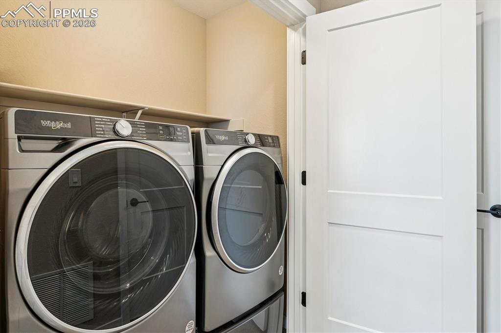 Image 20 of 22: Upper Level Laundry Closet - Premium Washer & Dryer Included