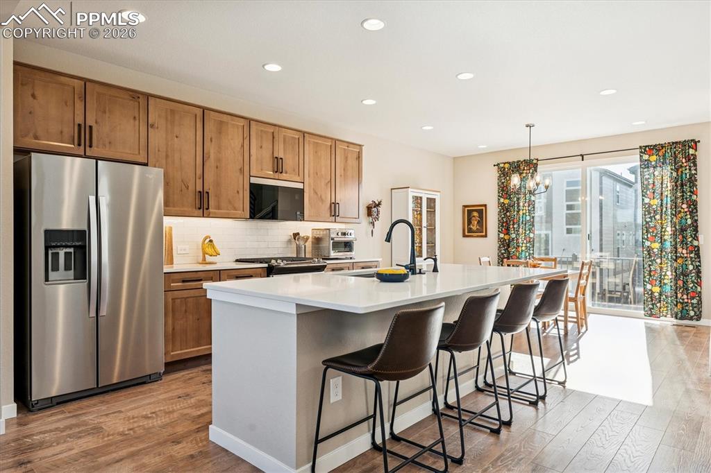 Image 3 of 22: Kitchen with Oversized Granite Island