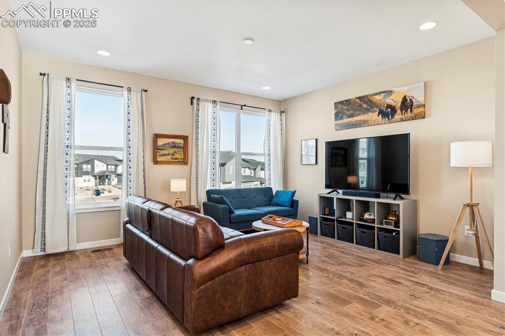 Image 5 of 22: Living Room with Natural Light from Large Windows