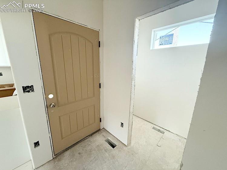 Image 10 of 29: Entry and Powder Bath. Please, excuse our dust as this home is currently un