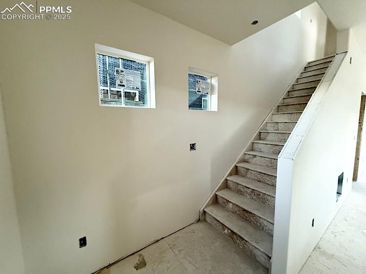 Image 12 of 29: Stairs to upper level. Please, excuse our dust as this home is currently un
