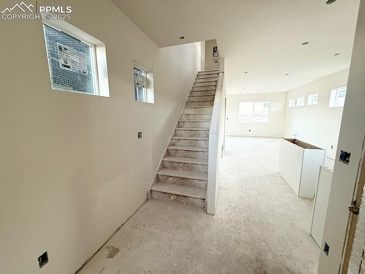Image 13 of 29: Stairs to upper level. Please, excuse our dust as this home is currently un
