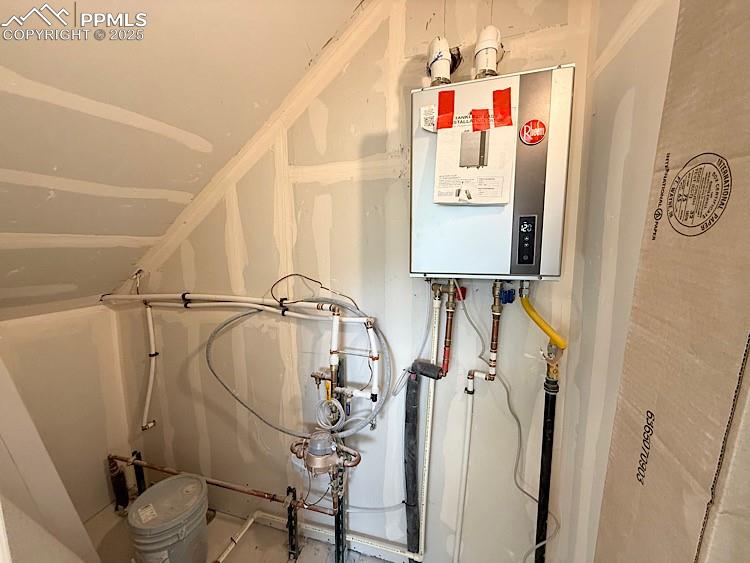 Image 34 of 35: Mechanical Room and access to Crawl Space. Please, excuse our dust as this