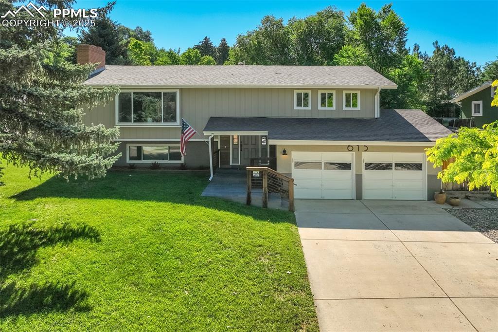 Caption: Beautiful bi-level home with oversized two car garage. 