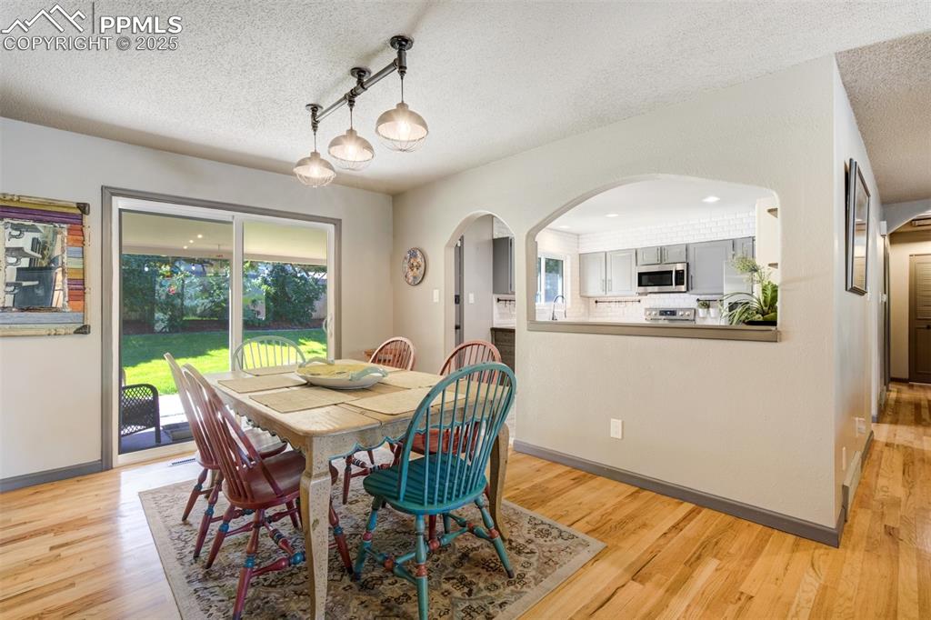 Image 15 of 50: View of dining room and kitchen with walk-out to the backyard
