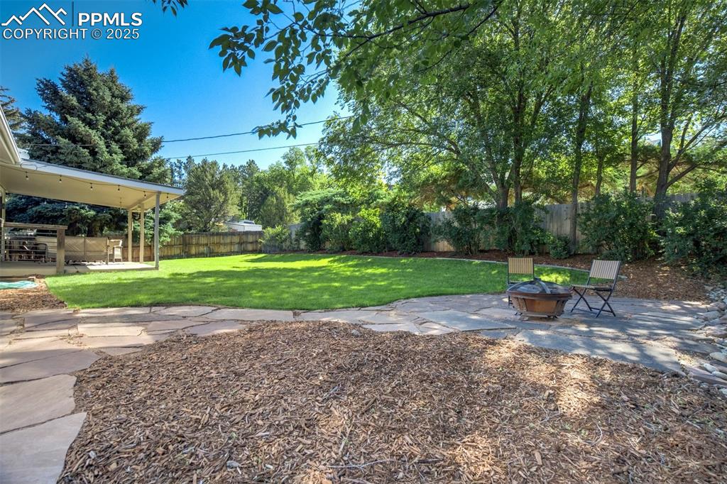 Image 45 of 50: Large yard with separate firepit area