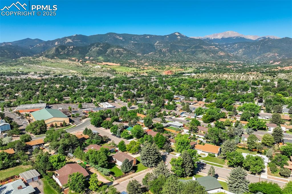 Image 5 of 50: side and back aerial view of corner lot