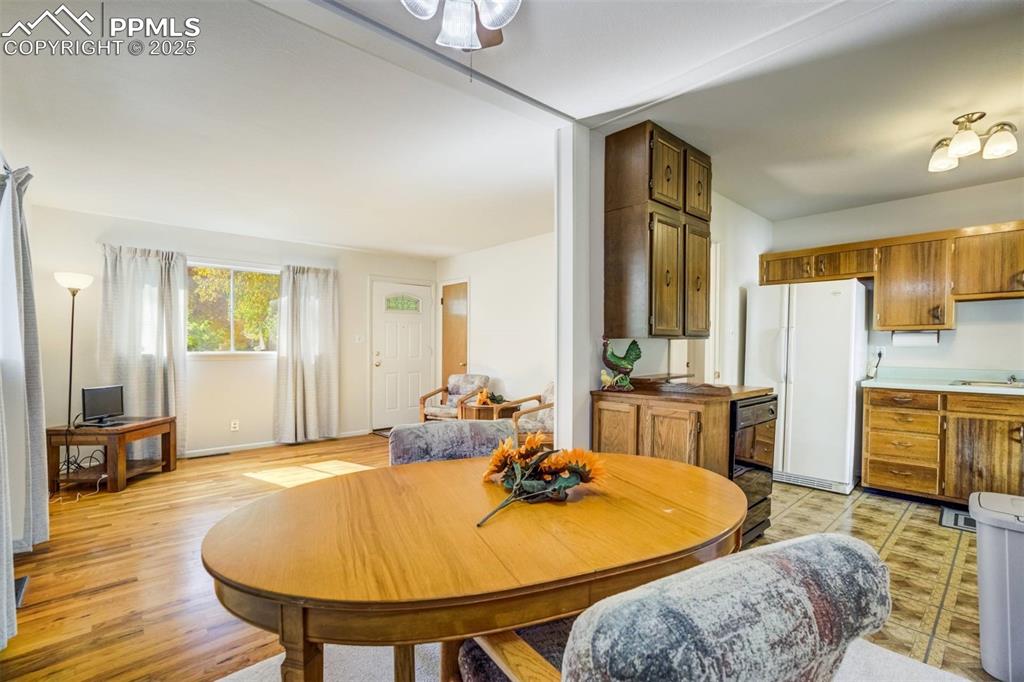 Image 10 of 47: Dining space with baseboards and light wood-type flooring