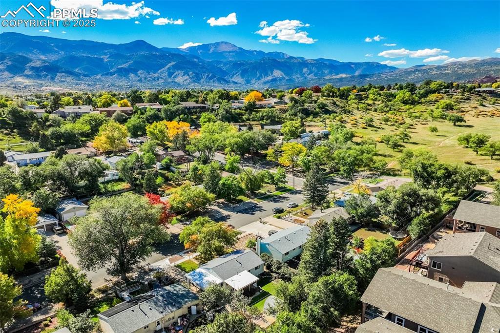 Image 2 of 47: Aerial view of residential area featuring mountains