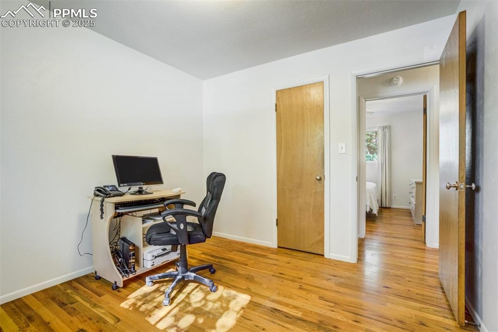 Image 25 of 47: Home office featuring light wood-type flooring and baseboards