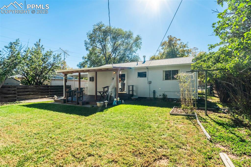 Image 40 of 47: Rear view of house with a patio
