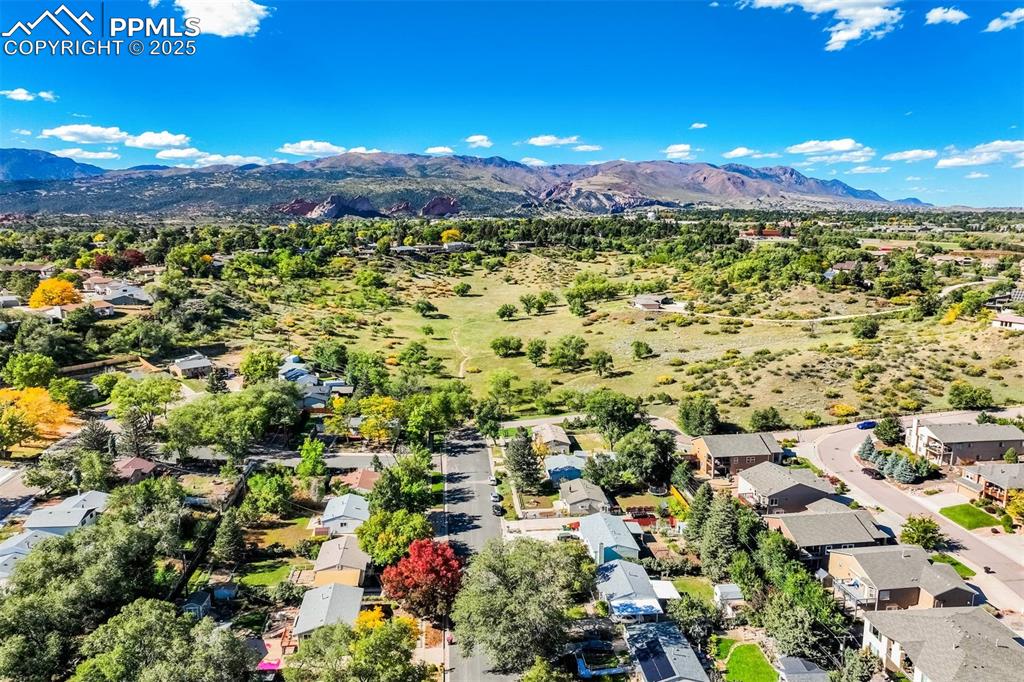 Image 46 of 47: Aerial view of residential area with mountains