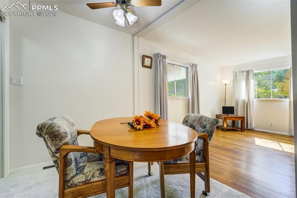 Image 9 of 47: Dining space featuring a ceiling fan and light wood-style floors