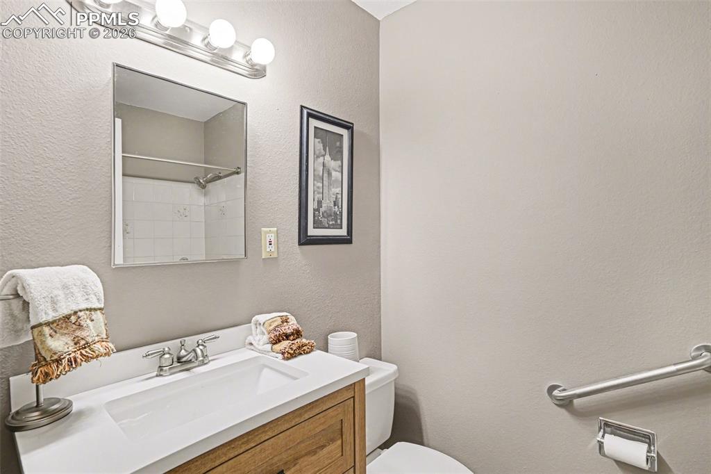 Image 12 of 21: Bathrooms shine with updated vanities, new tile flooring, and stylish fixtu