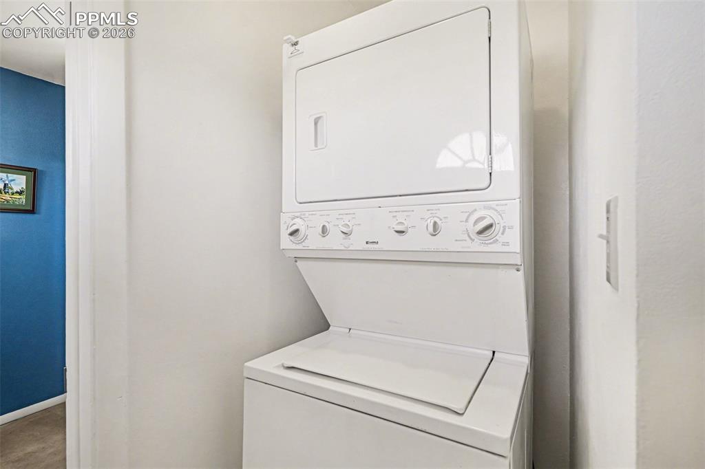 Image 18 of 21: Stacked washer and dryer included