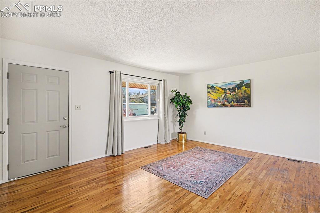 Image 3 of 21: Real oak wood flooring adds warmth and character