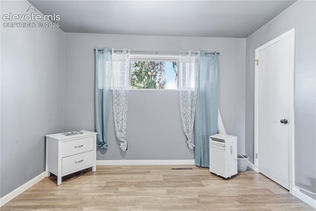 Image 13 of 22: CONVENIENT BUILT-IN SHELVING AND HANGING STORAGE