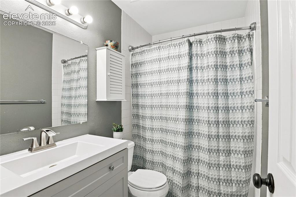 Image 15 of 22: LAUNDRY AREA OFFERS ADDITIONAL CABINET STORAGE AND WALK-OUT TO BACKYARD